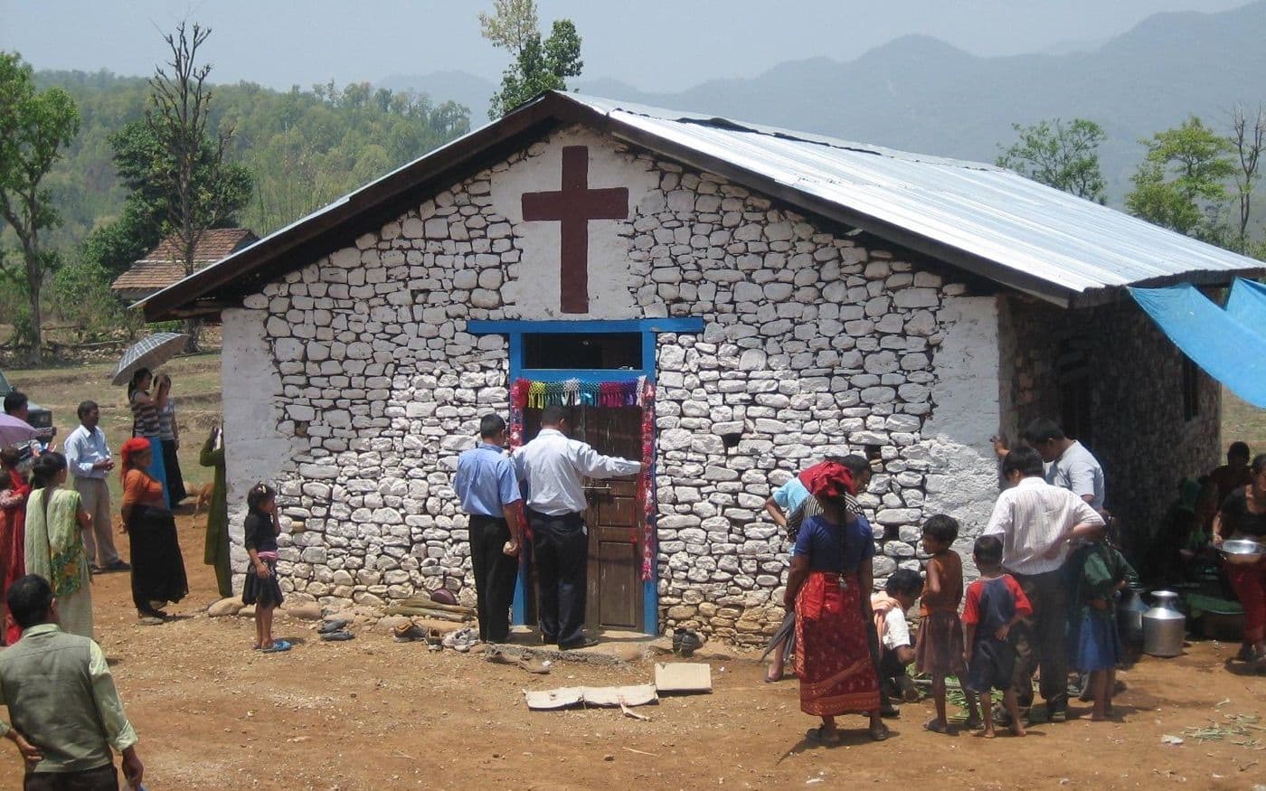 A local gathering outside a stone church in Nepal.