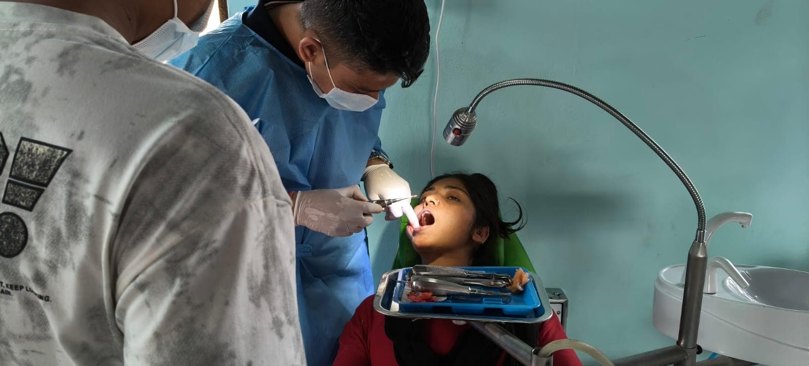 A dental team providing care during the Madi dental camp.